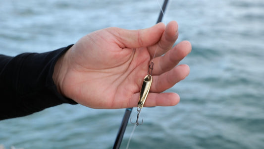 Fish Bum Heavy Hitter tungsten jigging spoon showing snap connection for walleye spoon fishing
