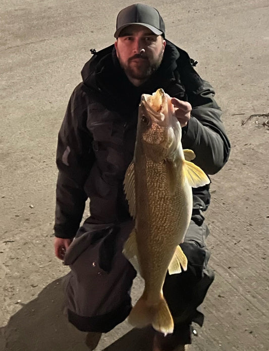 Walleye caught on a jig during prespawn season — river jig fishing techniques and staging locations
