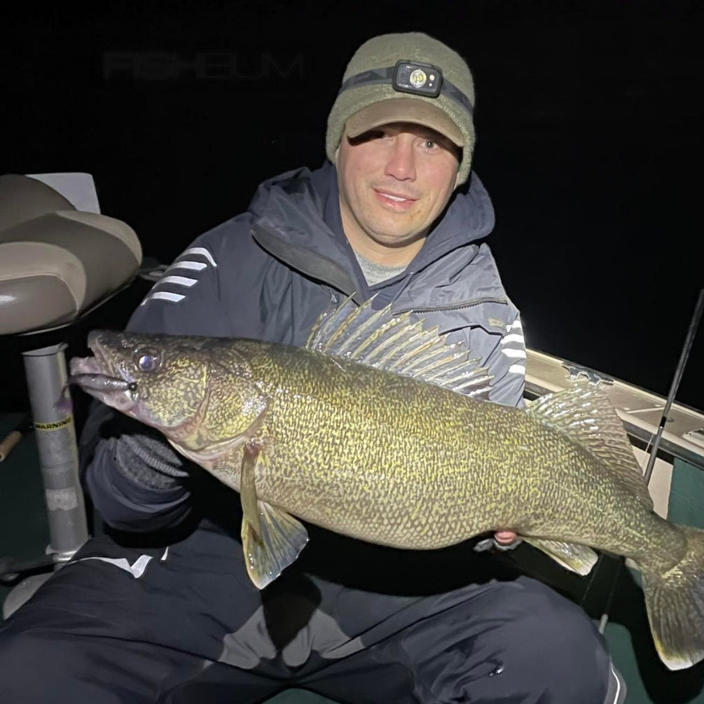 Man Holding Large Walleye Night Fishing